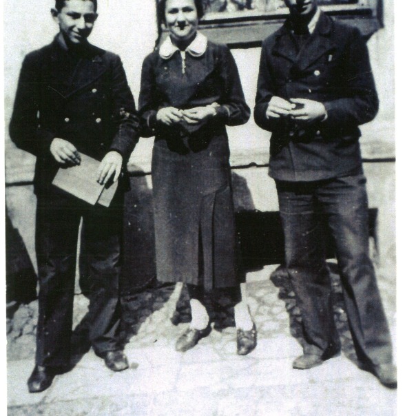 In the courtyard of the Tarbut Gymnasium, Vilnius, 1938. From left: Izya Katz, Chasia Spanerflig and Icchok Pinski. Both young men left for Palestine after graduating in 1938; Icchok Pinski later lived in Tel Aviv. Photocopy.